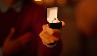 Person,,hand,and,ring,box,for,engagement,proposal,for,marriage